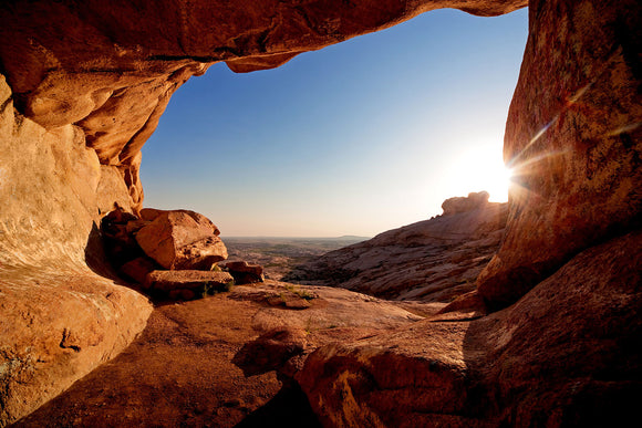 Fototapete Sonnenuntergang vor der Höhle