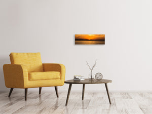 Leinwandbild Panorama Die Sonne geht unter