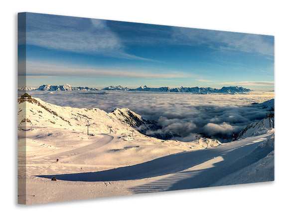 Leinwandbild Über den Wolken im Schnee